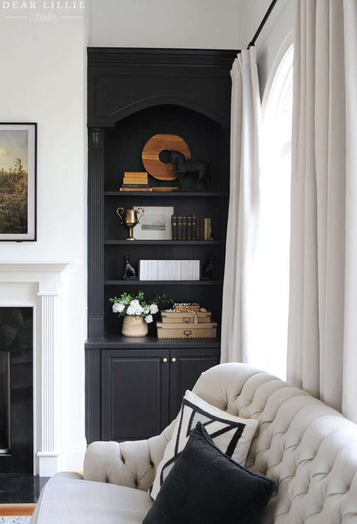 Freshly Painted Black Built In, White Fireplace Black Bookshelves